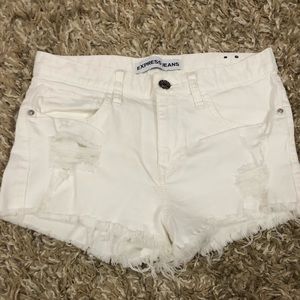 Mid rise distressed white shorts